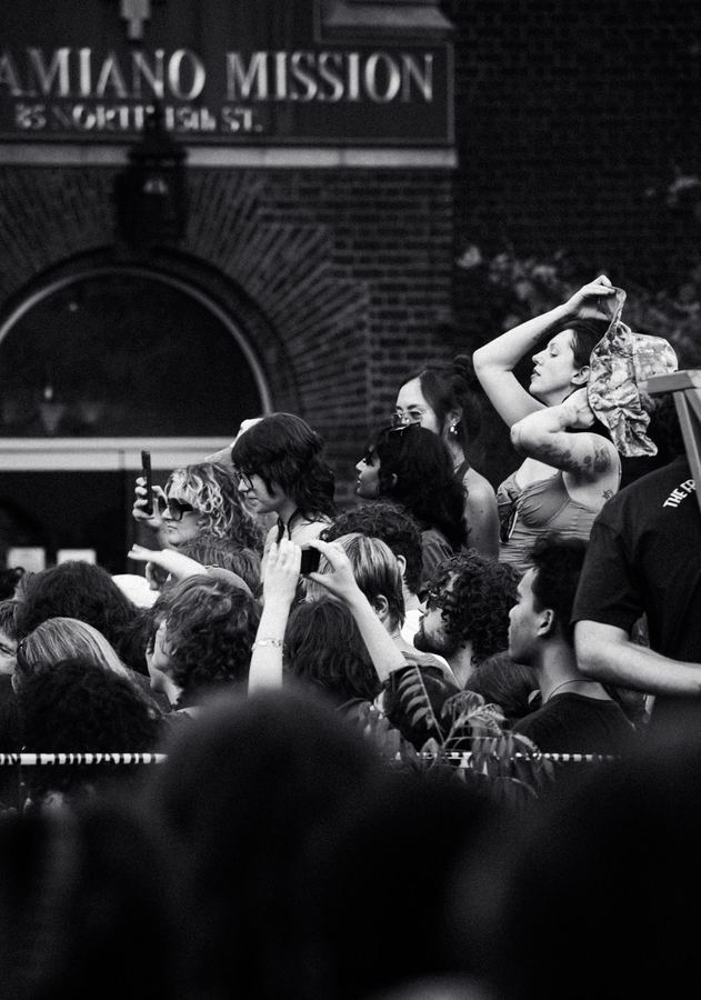 Crowd member's clasped hands at Geese show