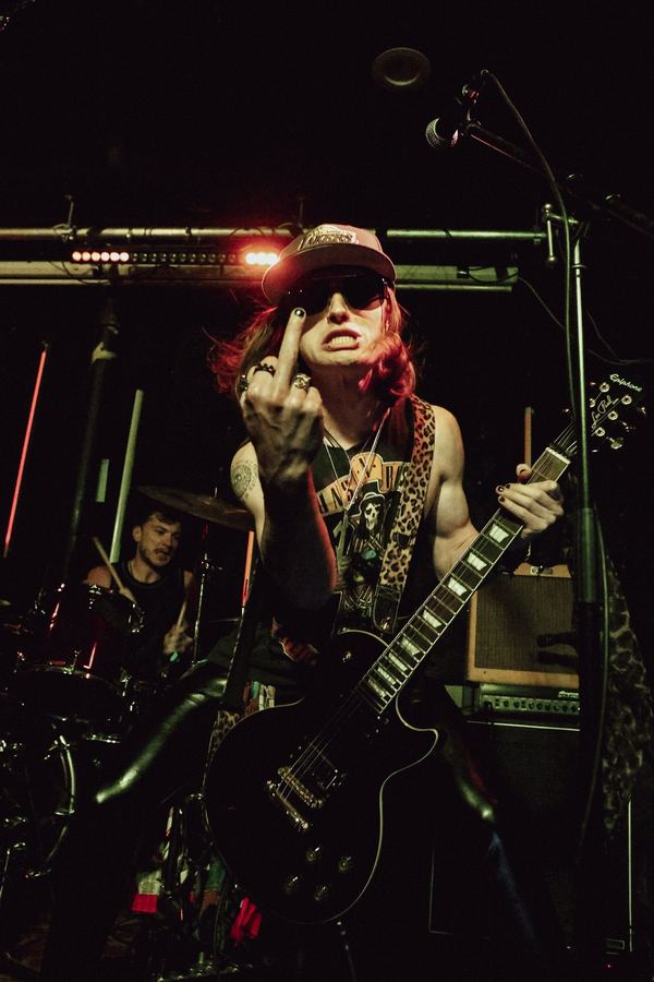 Vice Club guitarist gesturing at The Broadway