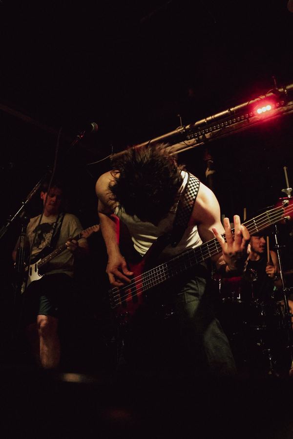 Vice Club bassist mid-performance at The Broadway