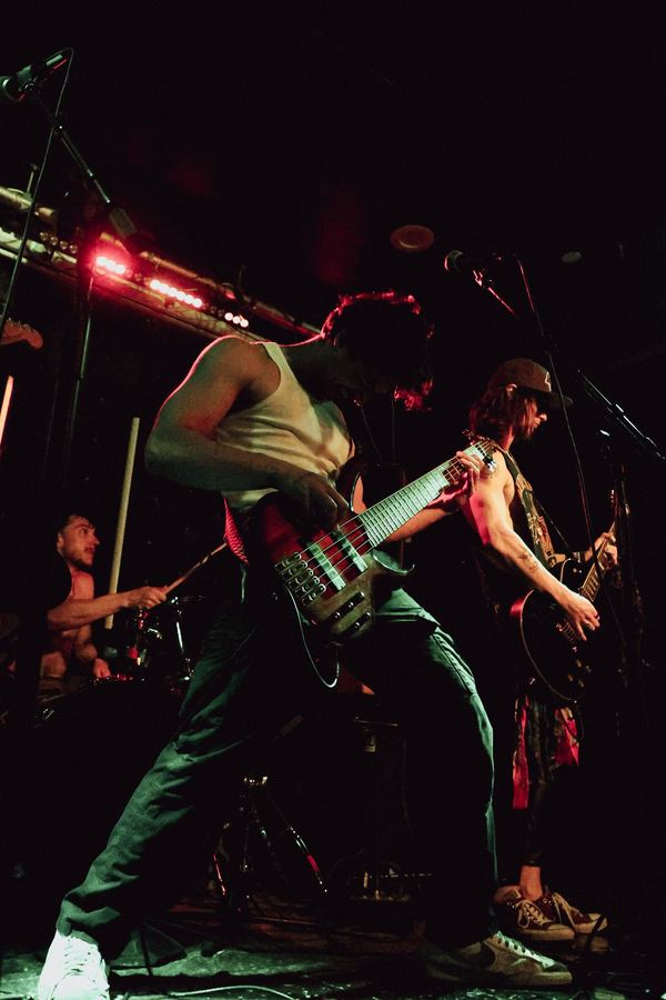 Vice Club bassist headbanging on stage at The Broadway